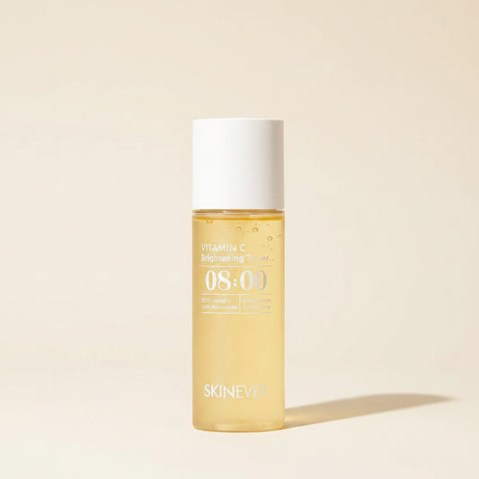 Skincare bottle labeled '08:00' by 'SKINVER' on a surface with a blurred indoor background